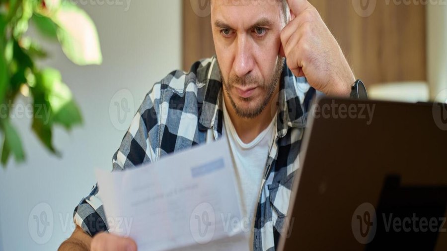 Person reviewing financial documents and bank statements