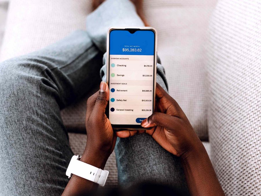 Person checking savings account interest rate on smartphone