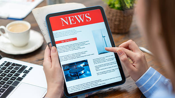 People reading financial news on tablets and newspapers